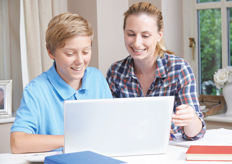 mother and son on laptop